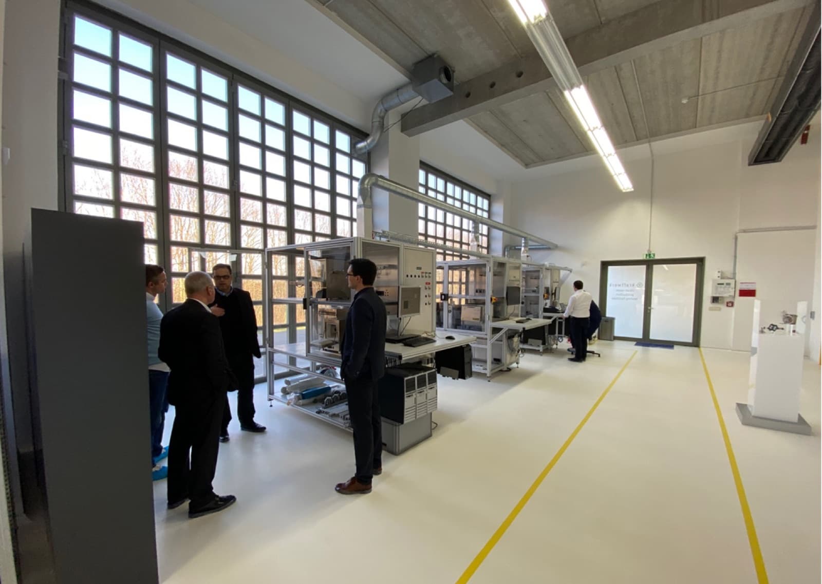 kraftwerk production floor with machines and engineers at work